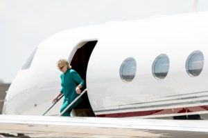 Democratic presidential candidate Hillary Clinton arrives at Des Moines International Airport in Des Moines, Wednesday, Aug. 10, 2016. Clinton is in town to tour Raygun, a printing, design and clothing company and attend a campaign rally. (AP Photo/Andrew Harnik)